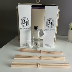 Diptyque 34 diffuser glass bottle and three sets of reeds